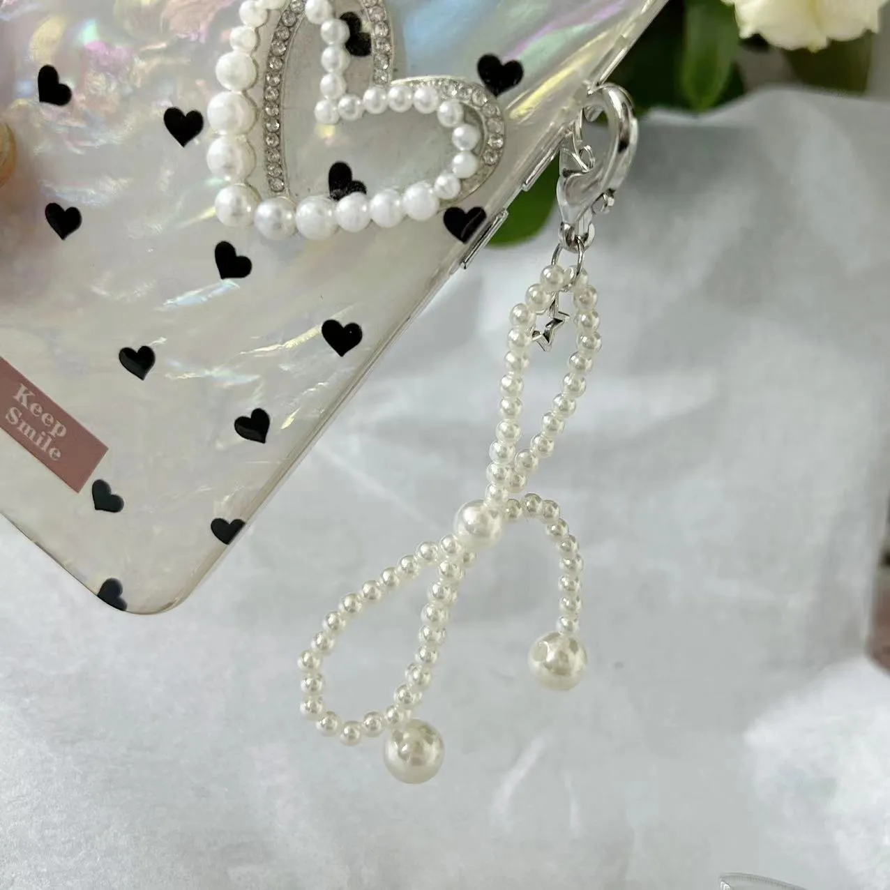 Beaded bow pearl charm