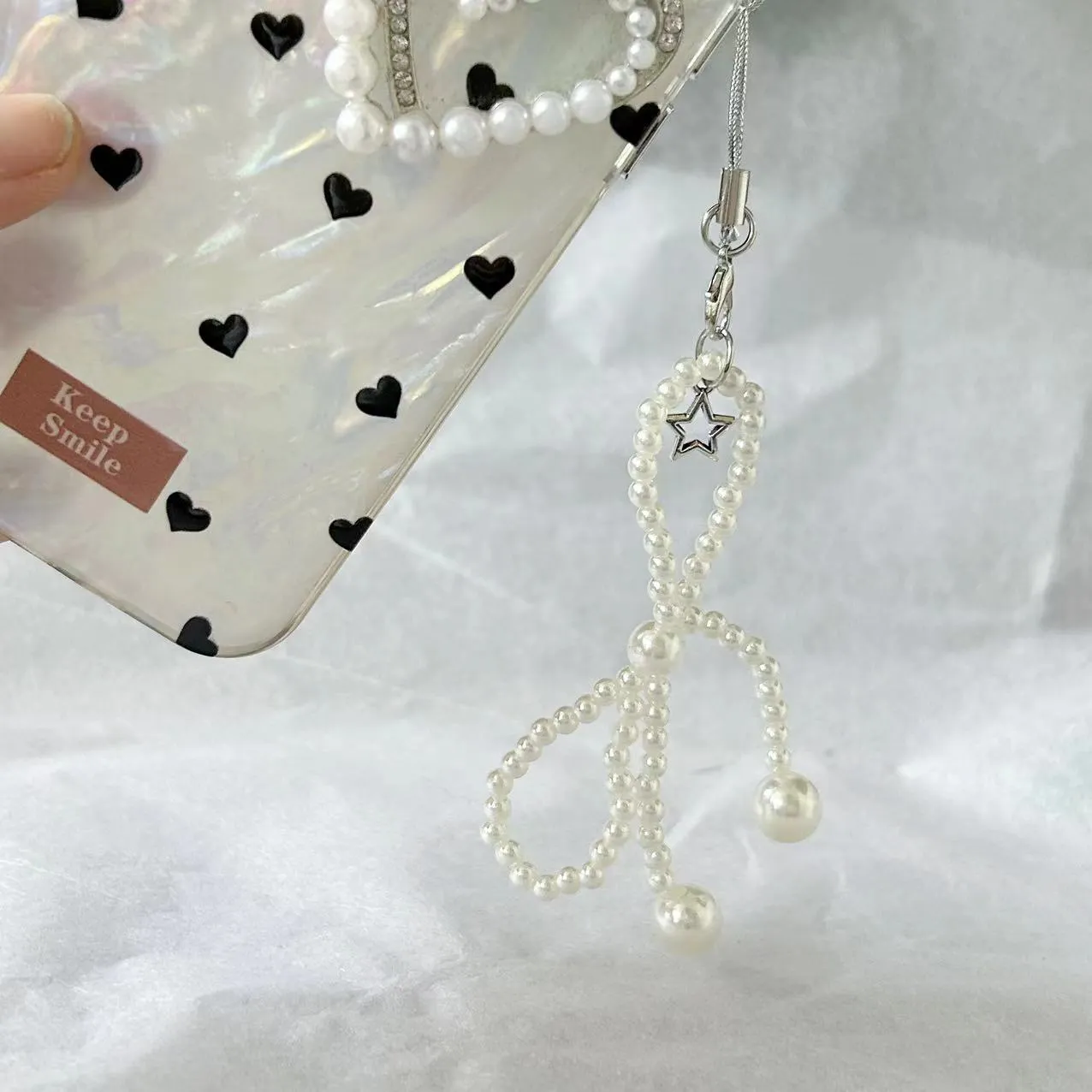 Beaded bow pearl charm