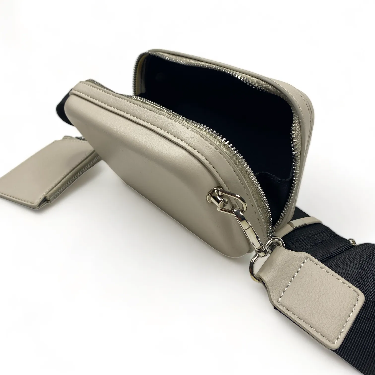 Faux leather hard shell crossbody bag with zip pouch