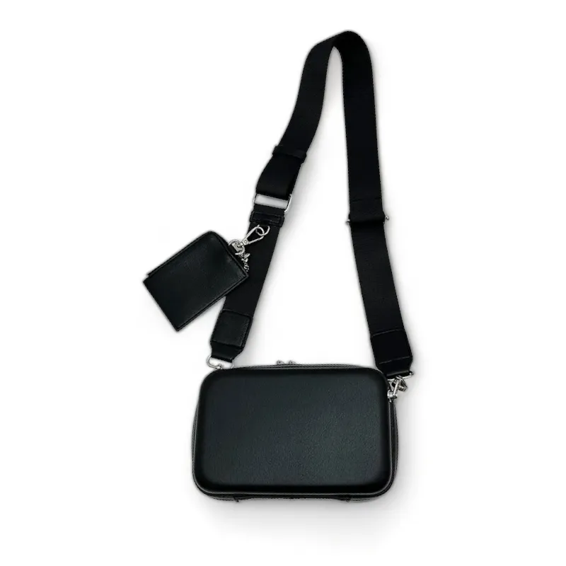Faux leather hard shell crossbody bag with zip pouch