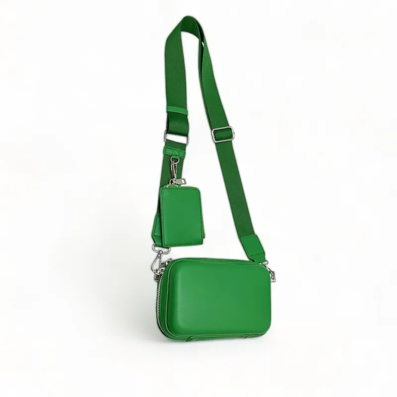 Faux leather hard shell crossbody bag with zip pouch