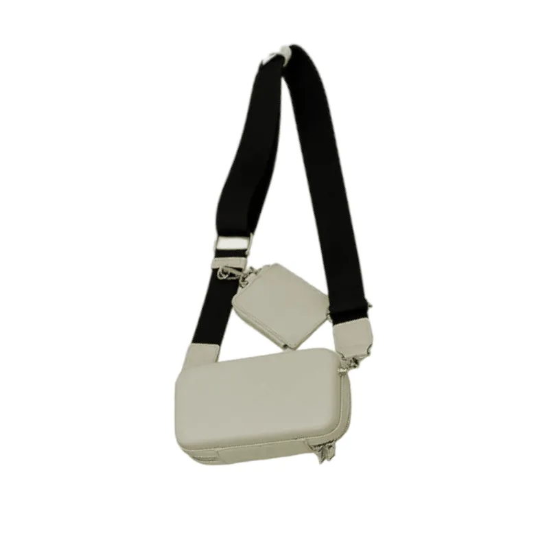 Faux leather hard shell crossbody bag with zip pouch
